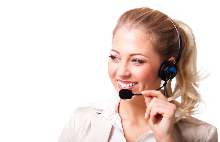Customer service representative: Customer service agent wearing a headset and smiling.